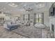 Bright living room with coffered ceiling, large sofa, and gray accent rug at 1323 Ashboro Ct., Myrtle Beach, SC 29579