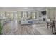 Well-lit living room featuring hardwood floors, fireplace, and an open-concept design at 1323 Ashboro Ct., Myrtle Beach, SC 29579