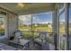 Relax on the screened porch with picturesque water views and comfortable seating at 1323 Ashboro Ct., Myrtle Beach, SC 29579