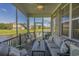 Spacious screened porch with ceiling fan and water views, perfect for outdoor living and entertaining at 1323 Ashboro Ct., Myrtle Beach, SC 29579