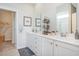Well-lit bathroom featuring double vanities, elegant fixtures, and ample storage space in a modern design at 1429 Nokota Dr., Conway, SC 29526
