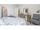 Serene bedroom with a beautifully dressed bed, dresser, and a calming color palette for relaxation at 1429 Nokota Dr., Conway, SC 29526