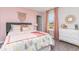 Charming bedroom with pink accents, cactus-themed bedding, and natural light from window at 1429 Nokota Dr., Conway, SC 29526