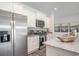 Modern kitchen with stainless steel appliances, granite countertops, and stylish white cabinetry at 1429 Nokota Dr., Conway, SC 29526