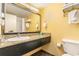 Bright bathroom featuring granite vanity top, large mirror, and tiled floor at 1501 S Ocean Blvd. # 805, Myrtle Beach, SC 29577