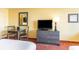 Bedroom with a table and chairs with a tv and dresser for relaxing in the room at 1501 S Ocean Blvd. # 805, Myrtle Beach, SC 29577