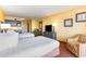 Bright bedroom with two beds, kitchenette and comfortable seating at 1501 S Ocean Blvd. # 805, Myrtle Beach, SC 29577