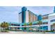 Beautiful hotel exterior showcasing its architecture, parking area, and landscaping at 1501 S Ocean Blvd. # 805, Myrtle Beach, SC 29577