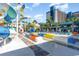 Outdoor view of brightly colored waterslides next to a multistory resort building, with lounge chairs and palm trees at 1501 S Ocean Blvd. # 805, Myrtle Beach, SC 29577