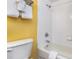 Clean bathroom featuring a toilet, tub, shower, and towel rack with fresh towels at 1501 S Ocean Blvd. # 915, Myrtle Beach, SC 29577