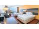 Bright bedroom with two beds and views to the water from the sliding glass doors at 1501 S Ocean Blvd. # 915, Myrtle Beach, SC 29577