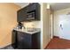 A cozy kitchenette that offers modern appliances and a functional layout, perfect for convenient meal preparation at 1501 S Ocean Blvd. # 915, Myrtle Beach, SC 29577