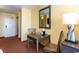 Interior view of a cozy hotel room, showing the desk, mirror, and chair at 1501 S Ocean Blvd. # 915, Myrtle Beach, SC 29577