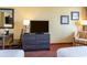 Interior view of a cozy hotel room, showing the TV and furniture at 1501 S Ocean Blvd. # 915, Myrtle Beach, SC 29577
