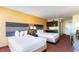 Interior view of a hotel room featuring two beds and a kitchenette at 1501 S Ocean Blvd. # 915, Myrtle Beach, SC 29577