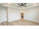 Spacious bedroom with an ensuite bathroom, tray ceiling, ceiling fan, and recessed lighting at 1514 Saw Palmetto St., North Myrtle Beach, SC 29582