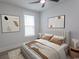 Spacious bedroom with a neutral palette, striking art, and a comfortable bed at 1514 Saw Palmetto St., North Myrtle Beach, SC 29582