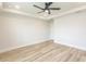Spacious bedroom with neutral walls, hardwood floors, a ceiling fan, and recessed lighting at 1514 Saw Palmetto St., North Myrtle Beach, SC 29582