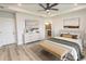 Stylishly decorated bedroom with modern furniture, neutral colors, and hardwood floors at 1514 Saw Palmetto St., North Myrtle Beach, SC 29582