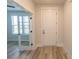 Bright entryway features modern wood-look floors and a decorative glass door leading to another room at 1514 Saw Palmetto St., North Myrtle Beach, SC 29582
