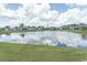 Serene lake view from the property, reflecting the sky and surrounded by lush greenery at 1514 Saw Palmetto St., North Myrtle Beach, SC 29582