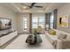 Living room boasts hardwood floors, ceiling fan, neutral decor and ample natural light at 1514 Saw Palmetto St., North Myrtle Beach, SC 29582