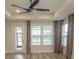 Living room features hardwood flooring, ceiling fan, natural light and neutral paint palette at 1514 Saw Palmetto St., North Myrtle Beach, SC 29582