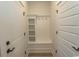 Well-organized mudroom with built-in shelves, coat hooks, and storage bench provides convenient storage at 1514 Saw Palmetto St., North Myrtle Beach, SC 29582