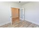 Spacious room with wood-look floors, glass paneled doors, and bright, natural light at 1514 Saw Palmetto St., North Myrtle Beach, SC 29582