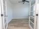 Cozy room with wood-look floors, a ceiling fan, and framed by glass doors at 1514 Saw Palmetto St., North Myrtle Beach, SC 29582