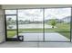 Enjoy outdoor living on this screened patio with lake views, perfect for relaxing or entertaining at 1514 Saw Palmetto St., North Myrtle Beach, SC 29582