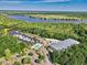 Overhead view of a river, marina and pool area surrounded by trees at 155 Preservation Circle, Pawleys Island, SC 29585