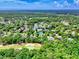 Aerial view of the homes with pond, golf course and lush green trees at 155 Preservation Circle, Pawleys Island, SC 29585