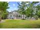 Beautiful backyard with patio, outdoor kitchen, and fire pit seating area at 155 Preservation Circle, Pawleys Island, SC 29585