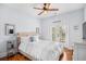 Bright bedroom featuring hardwood floors, ceiling fan, and balcony access at 155 Preservation Circle, Pawleys Island, SC 29585