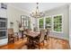 Well-lit dining room featuring a wooden table, chairs, and a window offering a pleasant outdoor view at 155 Preservation Circle, Pawleys Island, SC 29585