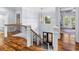 Bright foyer featuring wood floors, stairs with iron balusters, and lots of natural light at 155 Preservation Circle, Pawleys Island, SC 29585