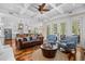 Comfortable living room with hardwood floors, a coffered ceiling, and access to the outdoor space at 155 Preservation Circle, Pawleys Island, SC 29585