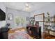 Cozy office with hardwood floors, custom desk, and ample shelving at 155 Preservation Circle, Pawleys Island, SC 29585
