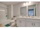 Bright bathroom with dual sinks, vanity, and shower-tub combination, offering modern amenities at 160 Juniata Loop, Little River, SC 29566