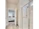 Modern bathroom with a glass-enclosed shower and a view into the adjacent bedroom at 160 Juniata Loop, Little River, SC 29566