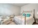 Bedroom with queen bed, decorative chair, and stylish metal frame accents at 160 Juniata Loop, Little River, SC 29566