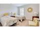 Charming bedroom featuring two twin beds, each adorned with floral quilts and decorative pillows at 160 Juniata Loop, Little River, SC 29566