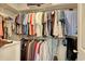 Organized walk-in closet with ample hanging space and shelving for clothes and accessories at 160 Juniata Loop, Little River, SC 29566