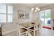 Dining area with bright natural light, a modern chandelier, and decor at 160 Juniata Loop, Little River, SC 29566