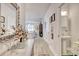 Hallway featuring decoratively adorned walls and leading into an open kitchen and living area at 160 Juniata Loop, Little River, SC 29566