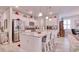 Open-concept kitchen with an island and white cabinets overlooking living area at 160 Juniata Loop, Little River, SC 29566