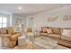 Comfortable living room with plush seating, glass coffee table, and stylish decor at 160 Juniata Loop, Little River, SC 29566