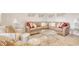 Spacious living area with an L-shaped sofa, glass table, and decorative wall art at 160 Juniata Loop, Little River, SC 29566