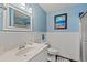 Bathroom featuring wainscoting, a vanity with sink, and a framed mirror and a stall shower at 1725 26Th Ave N, North Myrtle Beach, SC 29582
